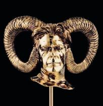 human head with horn in bronze